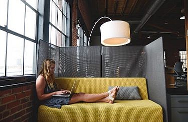 negative-space-woman-laptop-work-office-chilling-computer-couch-startup-stock-photos